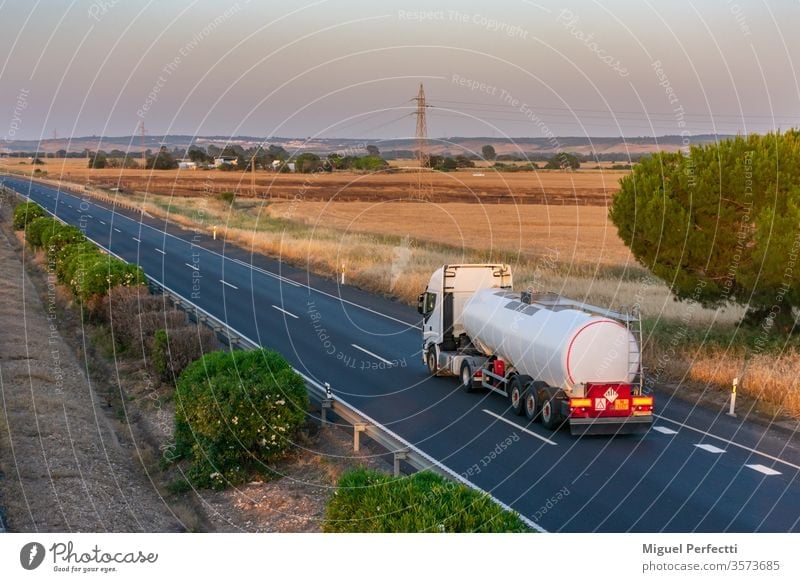 Tank truck with heat-insulated semi-trailer for the transport of liquids at high temperatures circulating on the highway. tank truck dangerous goods