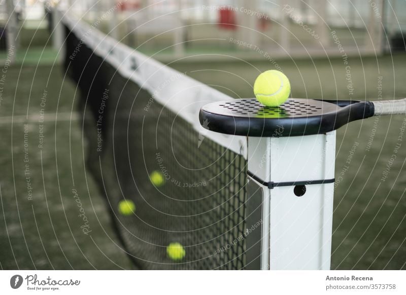 Paddle tennis racket and balls on court still life paddle tennis padel close up close-up pádel sport cut off white objects sports recreation no people nobody