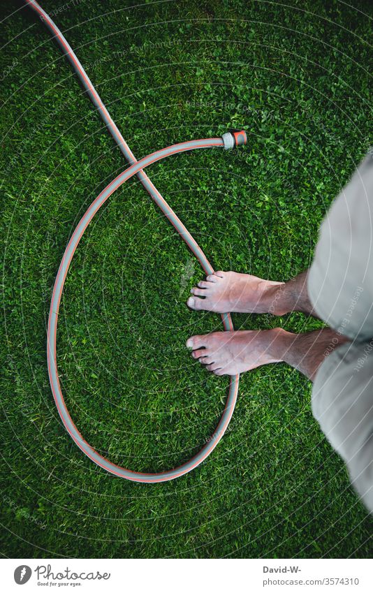 Literally l standing on the hose that Hose Stand Garden hose Lawn foot Man Figure of speech Proverb metaphor saying Muddled Helpless Planned blackout dumped