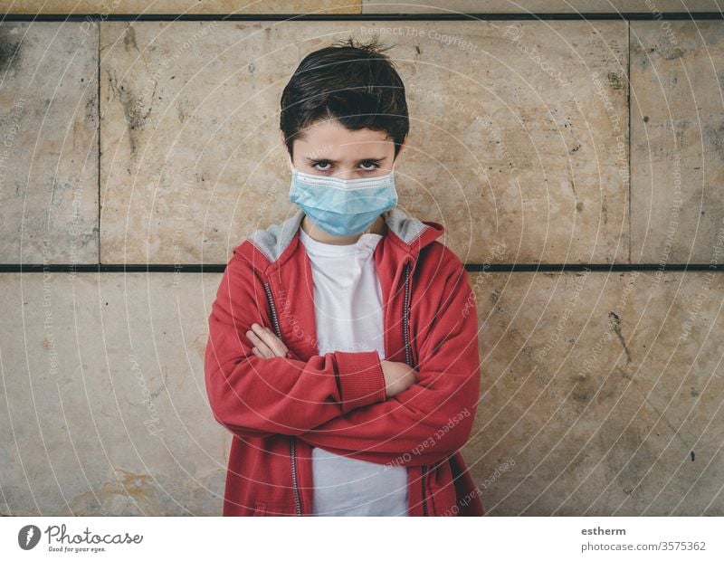 angry kid wearing medical mask coronavirus child epidemic pandemic thoughtful boy quarantine covid-19 symptom medicine health death protect childhood sadness
