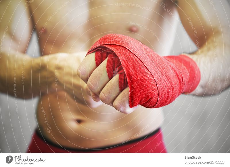 Hand In Red Boxing Bandages. Sports Armband. Isolated On White