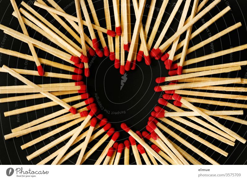 Photochallenge I matches on a black background - red match heads form a heart, other matches lie on top Match Heart disorder Love Burn Hot Ignitions wood Black