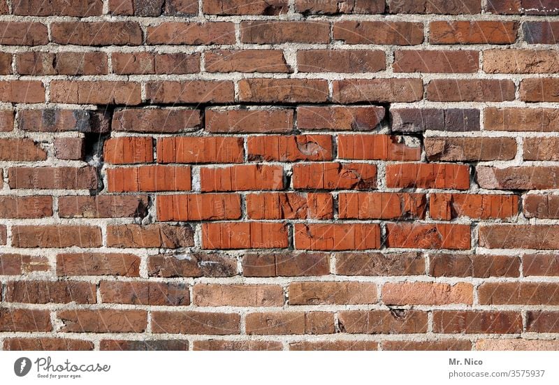 mended wall Masonry Brick rectangular Old Rough Construction Material Solid built Wall (building) Stone Red masonry Build Cement Weathered Dirty structure
