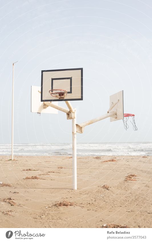 Beautiful basketball court in the middle of the beach Sport Nature Basketball Beach Sand Sun Water Ocean Minimalism