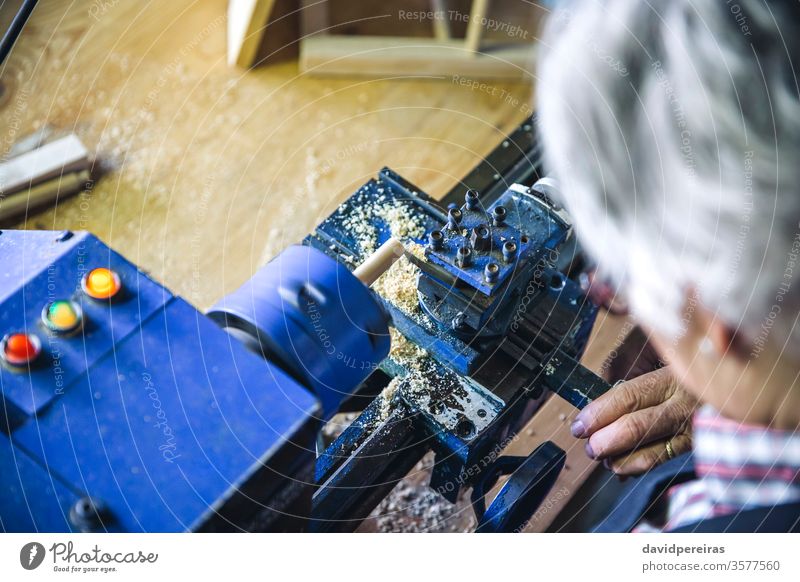 Top view of wooden lathe top view working carpentry detail closeup workshop carpenter sawdust business worker spinning craftsmanship hobby job maker person