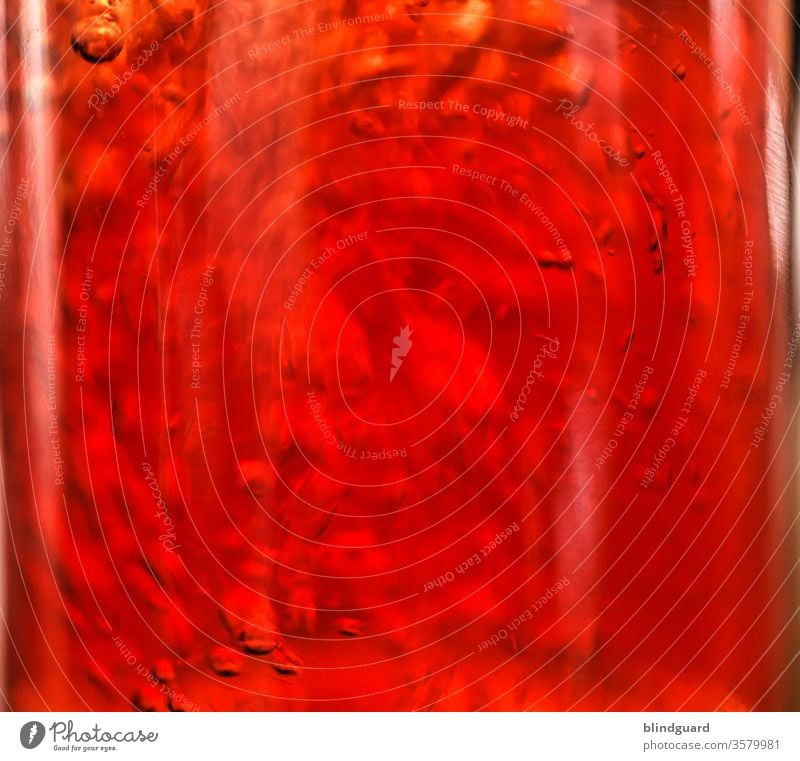 Liquid Trouble. Water swirls and air bubbles in red-orange liquid. Refreshing iced tea. vertebra blow Beverage Party Cocktail Iced tea Gastronomy Cold drink