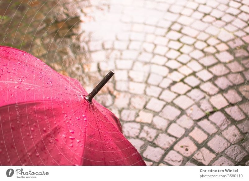 Umbrella in pink and natural stone - pavement, wet and shiny Magenta Umbrellas & Shades Rain Wet Puddle Paving stone natural stone pavement porphyry chill