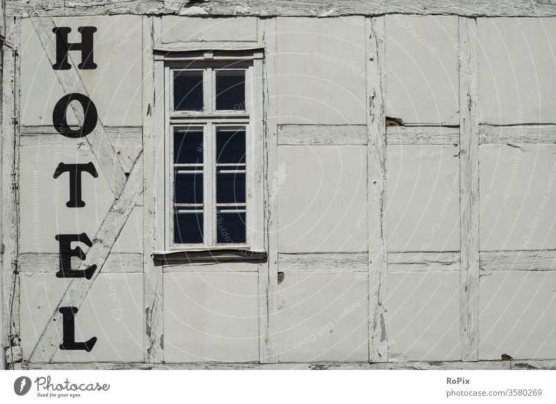 Historic half-timbered hotel facade... monochrome background granite rampart isolates concrete green paint industry close industrial structure abstract stripes