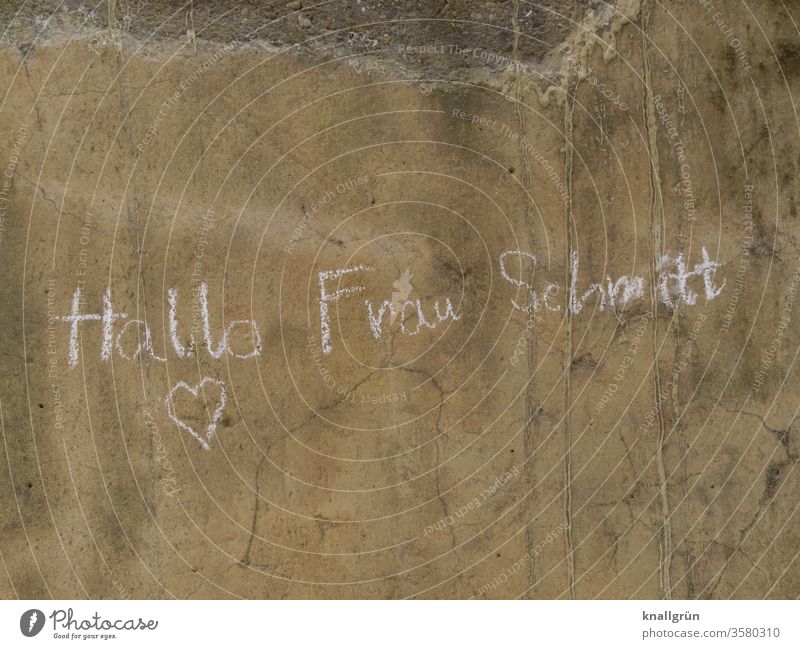 "Hallo Mrs. Schmitt" and a heart written with chalk on a brown, dirty wall Communication Love Emotions Heart Woman Declaration of love Chalk salute Romance