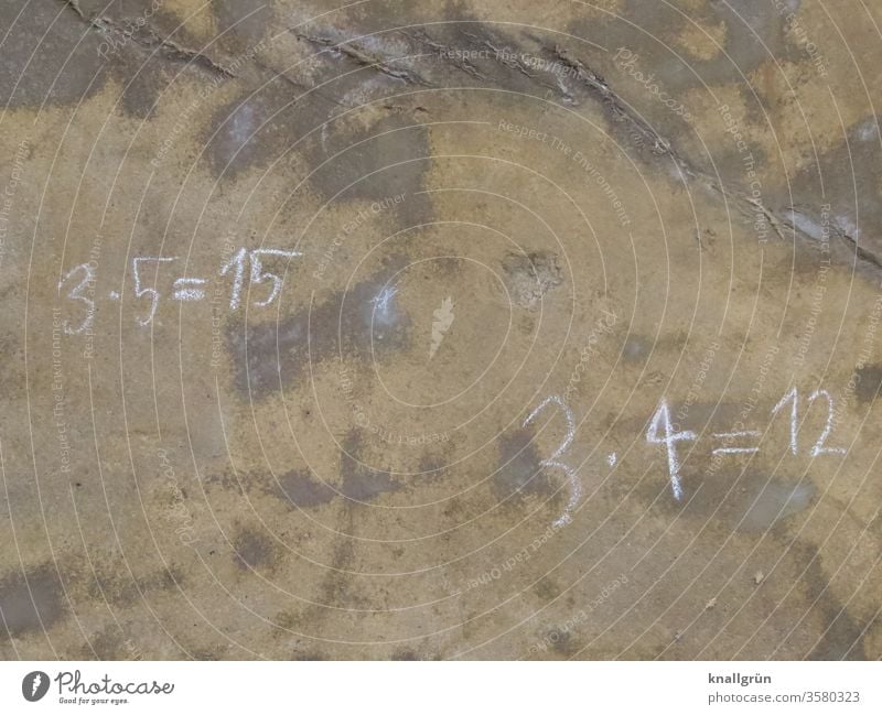 3 x 5 = 15 and 3 x 4 = 12 written with chalk on a brown stained wall Mathematics Digits and numbers Calculation figures Study Close-up Colour photo Deserted