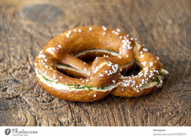 Bavarian pretzel with butter on wood Pretzel butter pretzel Butter pretzel Bread Germany Snack Fresh Breakfast Delicious Coffee background Eating Table