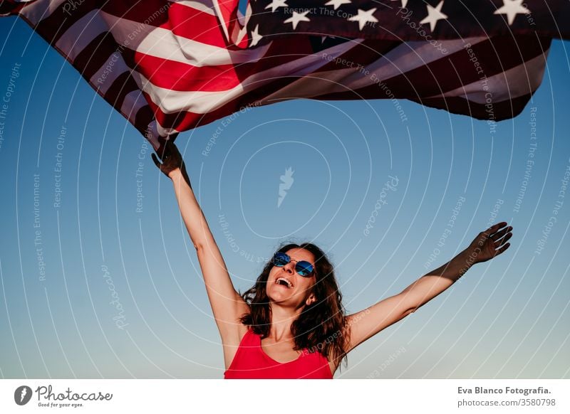 Free Photo  Usa independence day concept with woman showing us flag