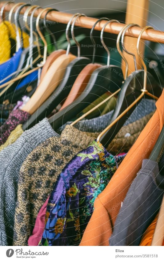 Clothes on a clothes rail in a Second-Hand shop or at the flea market garments Second-hand shop second hand business vintage Fashion Clothing Flea market cheap