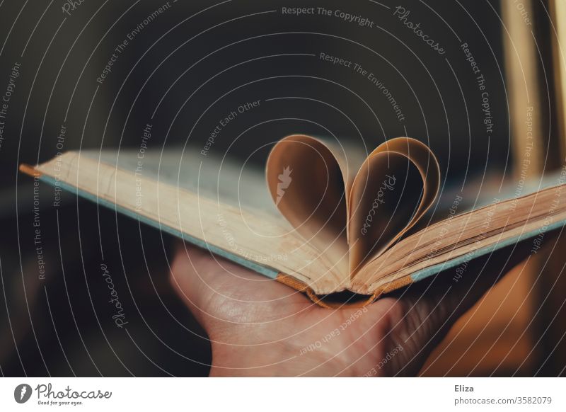 A heart from the pages of a book. Concept Love of literature and reading. Book Reading Literature Passion Heart concept Novel Education Read out loud