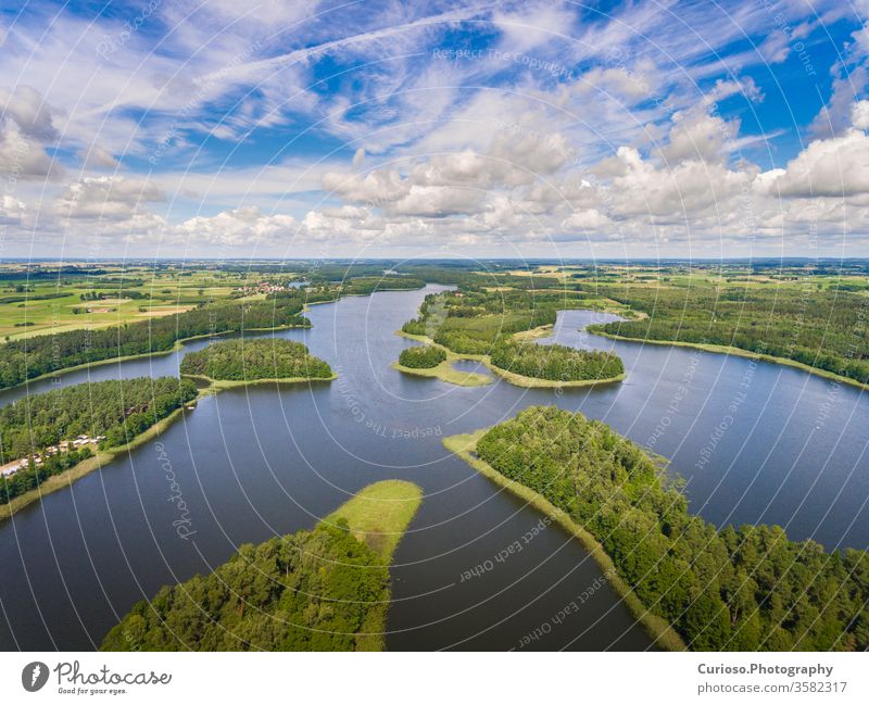 Aerial view of green islands and clouds at summer sunny day.Wydminy lake on Masuria in Poland. poland aerial mazury masuria beautiful landscape nature natural