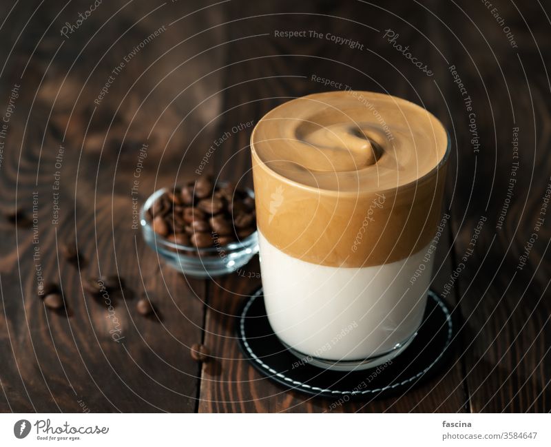 Dalgona coffee, copy space dalgona coffee wooden background whipped glass drink trendy beverage milk brown cup cold cream homemade food dessert delicious sugar