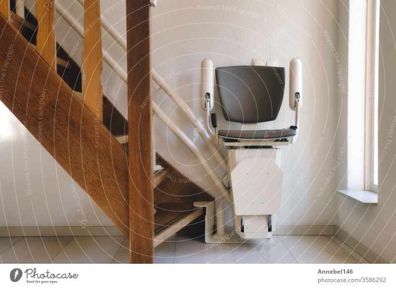 Automatic stairlift on a staircase for elderly or disabled people in a house, Design person House (Residential Structure) 3D Technology Banner handicap