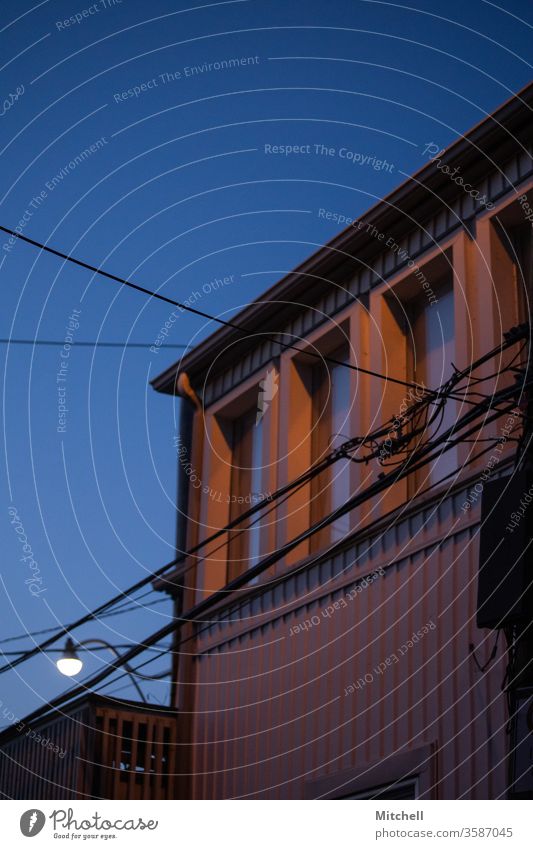 Building with Telephone wires in Blue Hour blue hour building architecture residential House (Residential Structure) Architecture Modern windows exterior sky