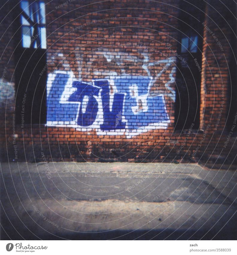 Inscription Liebe on a brick facade, graffiti, analog Analog Slide Town House (Residential Structure) Sky somber cross Cross processing Experimental Holga