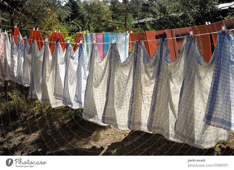 Wash day is before the next wash day Orderliness Design Many Sunlight Shadow Pattern Side by side Dry Cleaning Symmetry Determination clothesline Dish towel