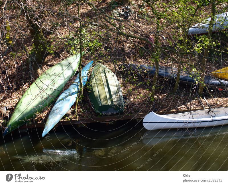 Boat fallow boats Canoes bank steep River decommissioned temporise Parking Nature Trip Adventure Forest free time Sports Landscape Aquatics Exterior shot