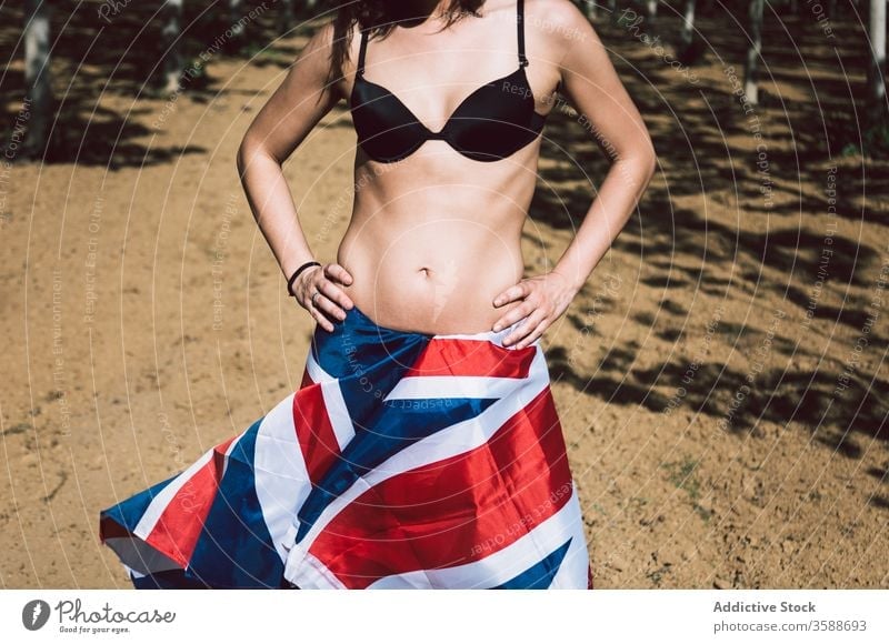 Anonymous young woman in park lesbian summertime underwear lingerie bra uk england gay great britain flag stand lgbt lgbtq homosexual lifestyle sensual freedom
