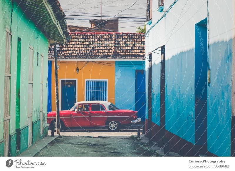 Colorful houses and vintage cars in Trinidad, Cuba. Unesco World Heritage Site. america antique architecture attraction beautiful building caribbean city
