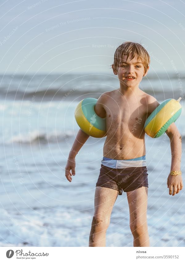 young boy and the ocean Boy (child) Swimming & Bathing Swimwear Ocean Tuscany Joy Vacation & Travel Water Summer Child Beach Playing Sand sandy Small Wet Happy