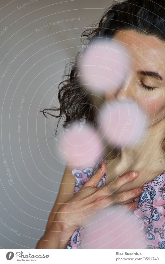 woman with closed eyes, flowers cover her mouth and one eye Woman Studio shot Colour photo Shame Emotions Black 30 - 45 years Adults Feminine Human being
