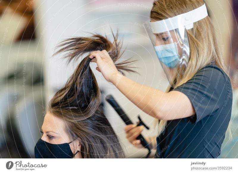 Crazy girl with scissors. Hairdresser in action. Stock Photo