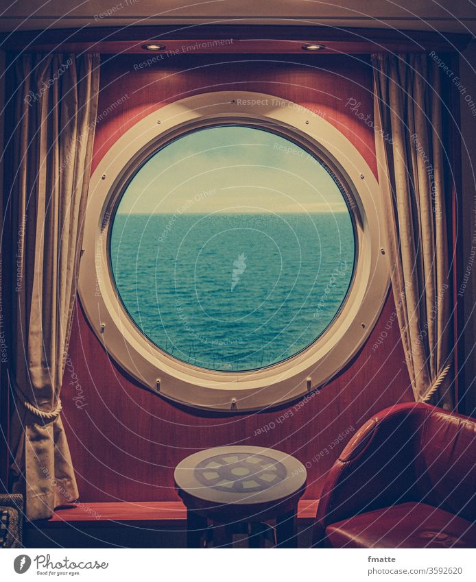 Porthole on the ferry Ferry Lake seafaring vacation Cruise cabin voyage ocean Land in sight