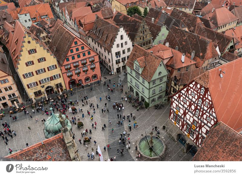 Looking down onto the square of Rothenburg, Germany during a local medieval festival aerial architecture building buildings city cityscape citysquare colors