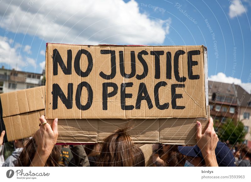 No justice - no peace. No justice - no peace. Cardboard sign with inscription on black lives matter - demonstration against racism and police violence