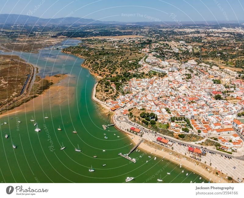 Aerial view of nature and city of Alvor, Algarve, Portugal alvor algarve portugal seaside seascape bay aerial landscape aerial view marina alvor portugal