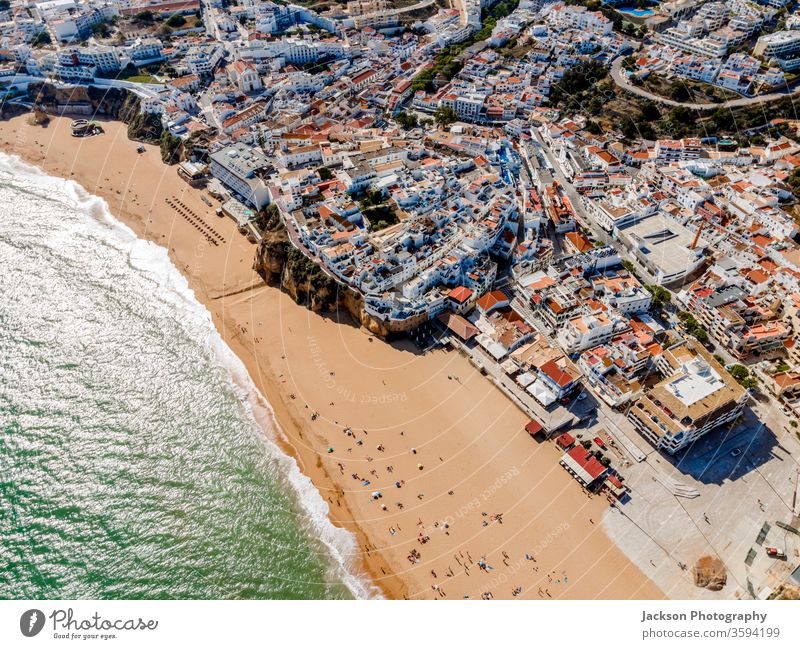 Aerial view of seaside Albufeira in Algarve, Portugal. architecture portugal albufeira beach aerial ocean white city town pier nature outdoor building