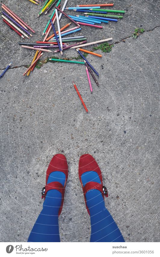 female legs in front of a pile of crayons on asphalt Painting (action, artwork) Draw Heap Muddled dropped Street Asphalt Many Woman feminine Stand Legs foot