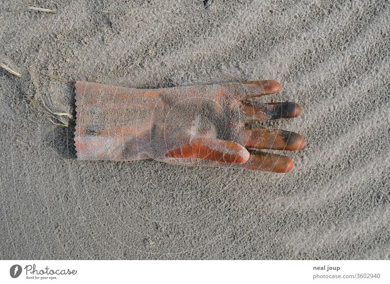 Plastic waste on the beach - Glove orange Environmental pollution plastic Rubber Trash Ocean Beach Sand Coast Recycling Problem Nature dirt Shackled ecologic