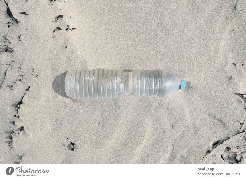 Plastic waste on the beach - bottle, transparent Environmental pollution plastic Rubber Trash Ocean Beach Sand Coast Recycling Problem Nature dirt Shackled