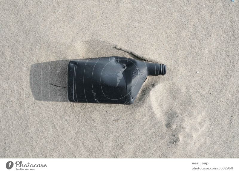 Plastic waste on the beach - jerry can, black Environmental pollution plastic Rubber Trash Ocean Beach Coast Recycling Problem Nature dirt Shackled ecologic