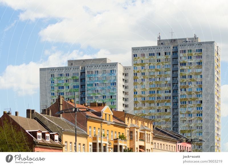 Old before new building Facade Prefab construction Architecture Lichtenberg Sunlight Style Old building Urban development Sky Clouds Gloomy Tower block