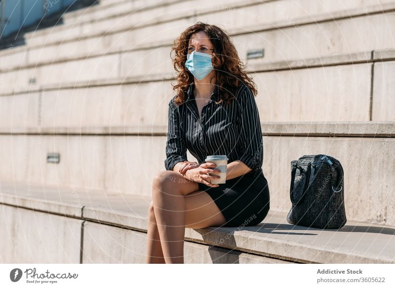 Business woman having a coffee break in the city. business people cafe female cup drink street lifestyle sitting adult person urban businesswoman beautiful