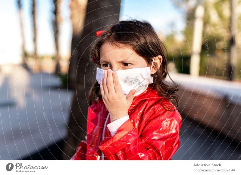 Ethnic girl in surgical mask on street medical child enjoy weekend covid 19 protect ethnic childhood kid cheerful city stand safety care healthy health care