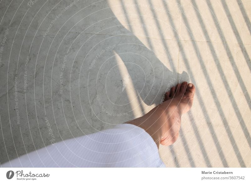 Shadow lines over a woman's foot showing concept of feminism, gender equality and women's rights Women's Day International Women's Day Conceptual shadow lines