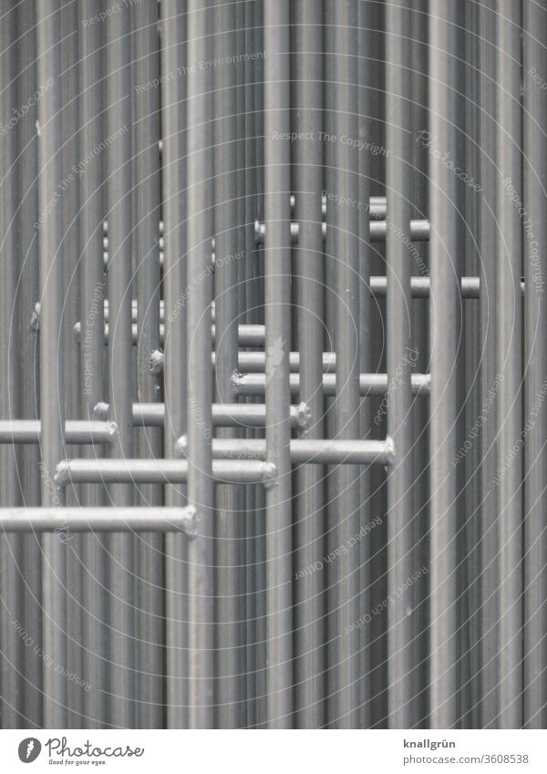 Close-up of several barrier grids standing one behind the other Protective Grating Barrier Safety Protection Exterior shot Fence Metal Border