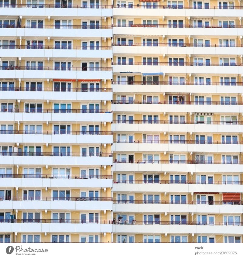 View of a facade of a Berlin high-rise building with balconies and windows Loneliness Concrete Living or residing New building GDR Marzahn Marzahn-Hellersdorf