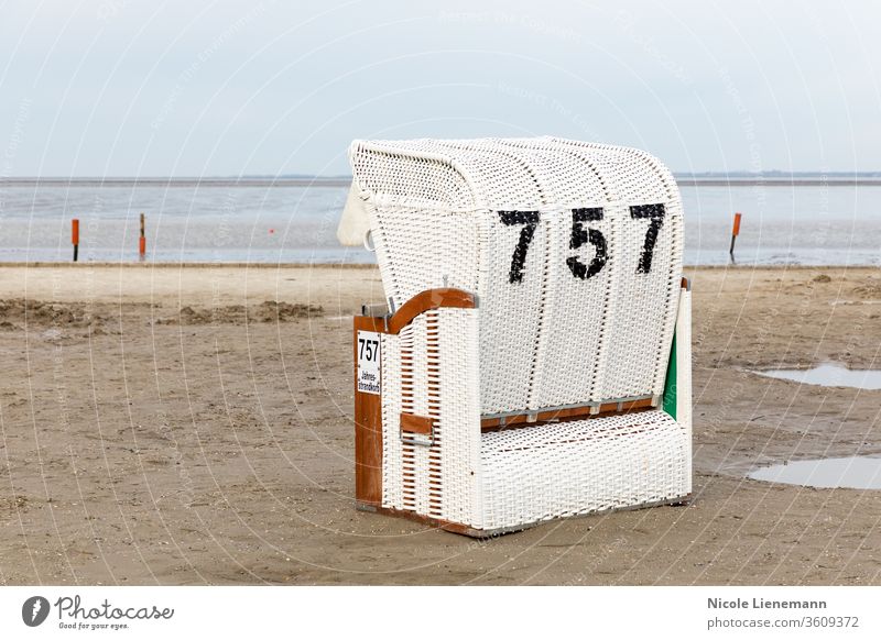 Beach chair on the North Sea beach in Germany beach chair white north sea germany sky water blue ocean travel landscape nature coast summer shore wave cloud