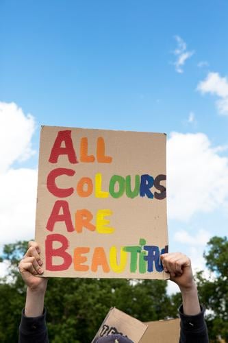 All colours are beautiful.black lives matter - Demonstration in Cologne on 06.06.2020. BLM, blacklivesmatter, against racism and police violence.Colourful writing on a cardboard sign