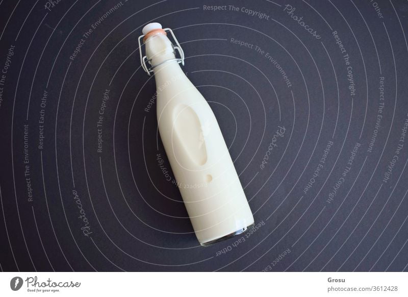 https://www.photocase.com/photos/3612428-isolated-milk-bottle-on-dark-background-with-copy-field-for-text-photocase-stock-photo-large.jpeg