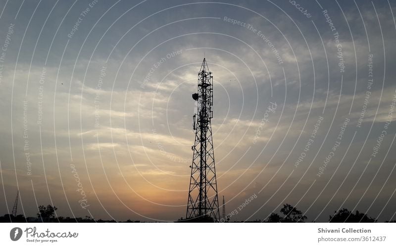 Telecommunication tower in India at the beautiful evening sunset moments with colourful sky background. antenna blue broadcast broadcasting cell cellular
