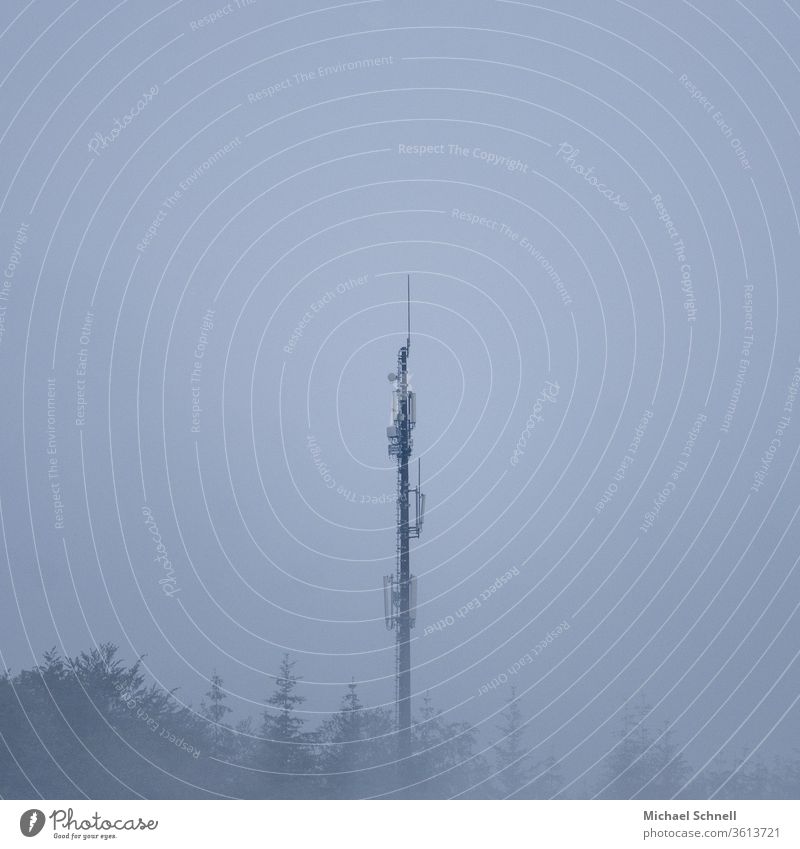 Transmission mast in foggy weather Broadcasting tower Exterior shot Deserted Colour photo Sky Copy Space top Day Antenna Telecommunications Technology